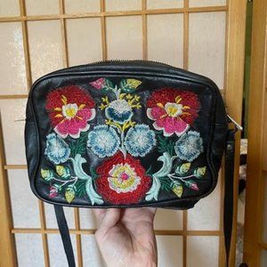 Small leather cross body bag with embroidered flowers